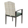 Rear-side view of aluminum hotel chair with patterned backrest and green seat cushion