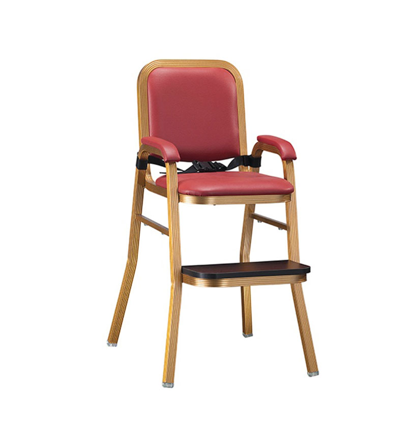 Red upholstered hotel baby high chair with safety belt, footrest, and golden frame on white background