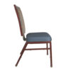 Side profile of patterned aluminum banquet chair with blue cushion and ergonomic design