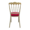 Back view of gold Napoleon chair with classic spindle design and red cushion