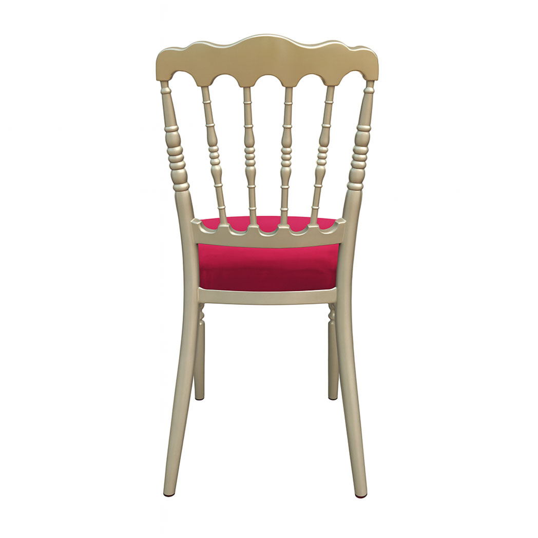Back view of gold Napoleon chair with classic spindle design and red cushion