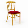 Side profile of gold metal banquet chair with red seat for hotel and wedding hall