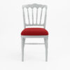Side view of silver Napoleon banquet chair with red cushion for weddings and hotel events