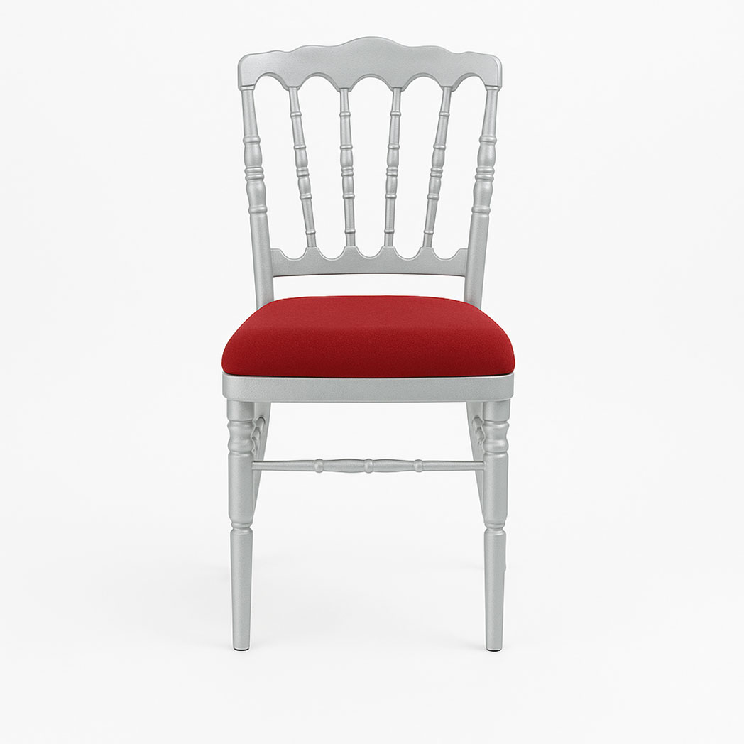 Side view of silver Napoleon banquet chair with red cushion for weddings and hotel events