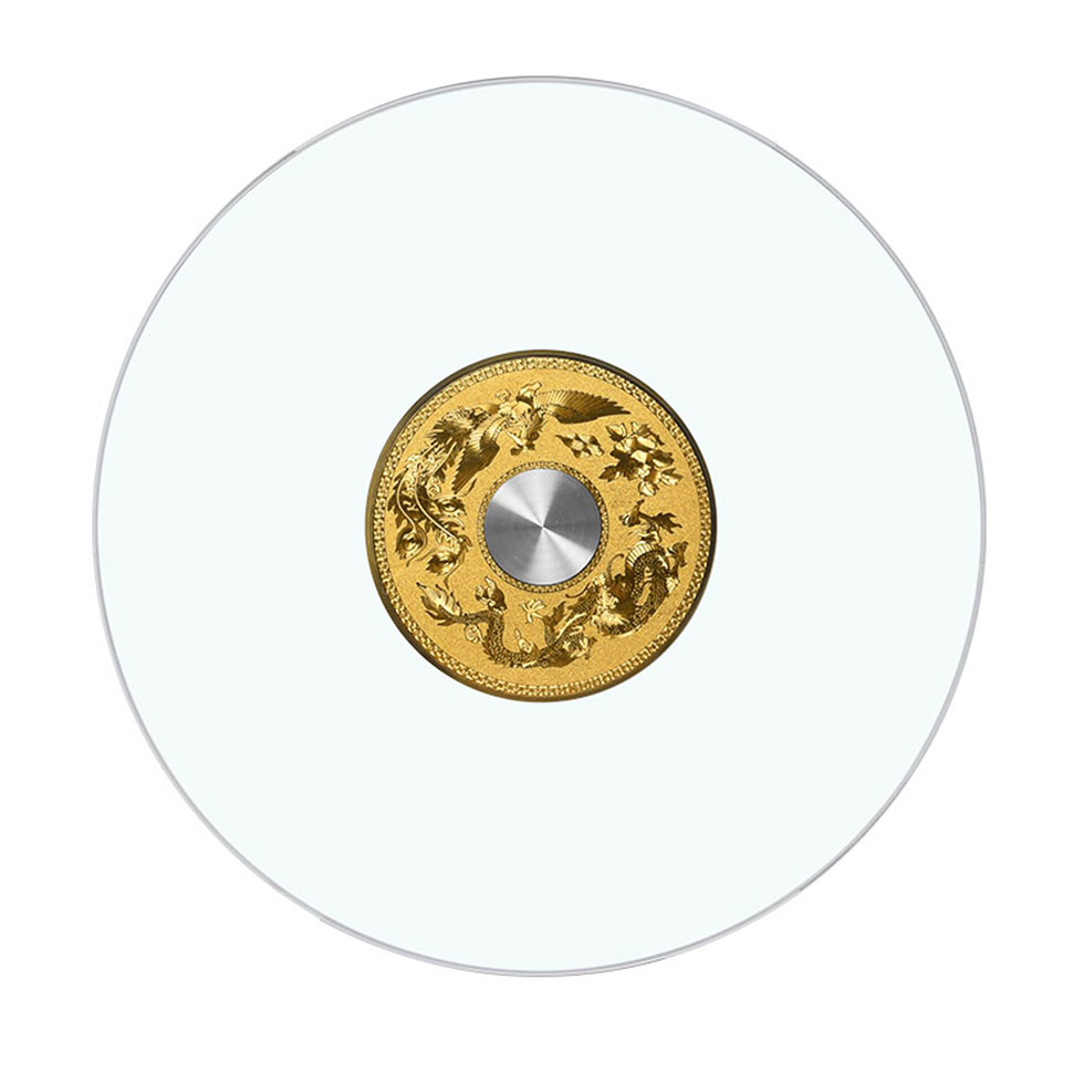 Top view of a round tempered glass Lazy Susan turntable featuring a detailed gold dragon base with central bearing