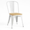 Front angled view of a white metal dining chair with a natural wood seat, ideal for restaurant and café use