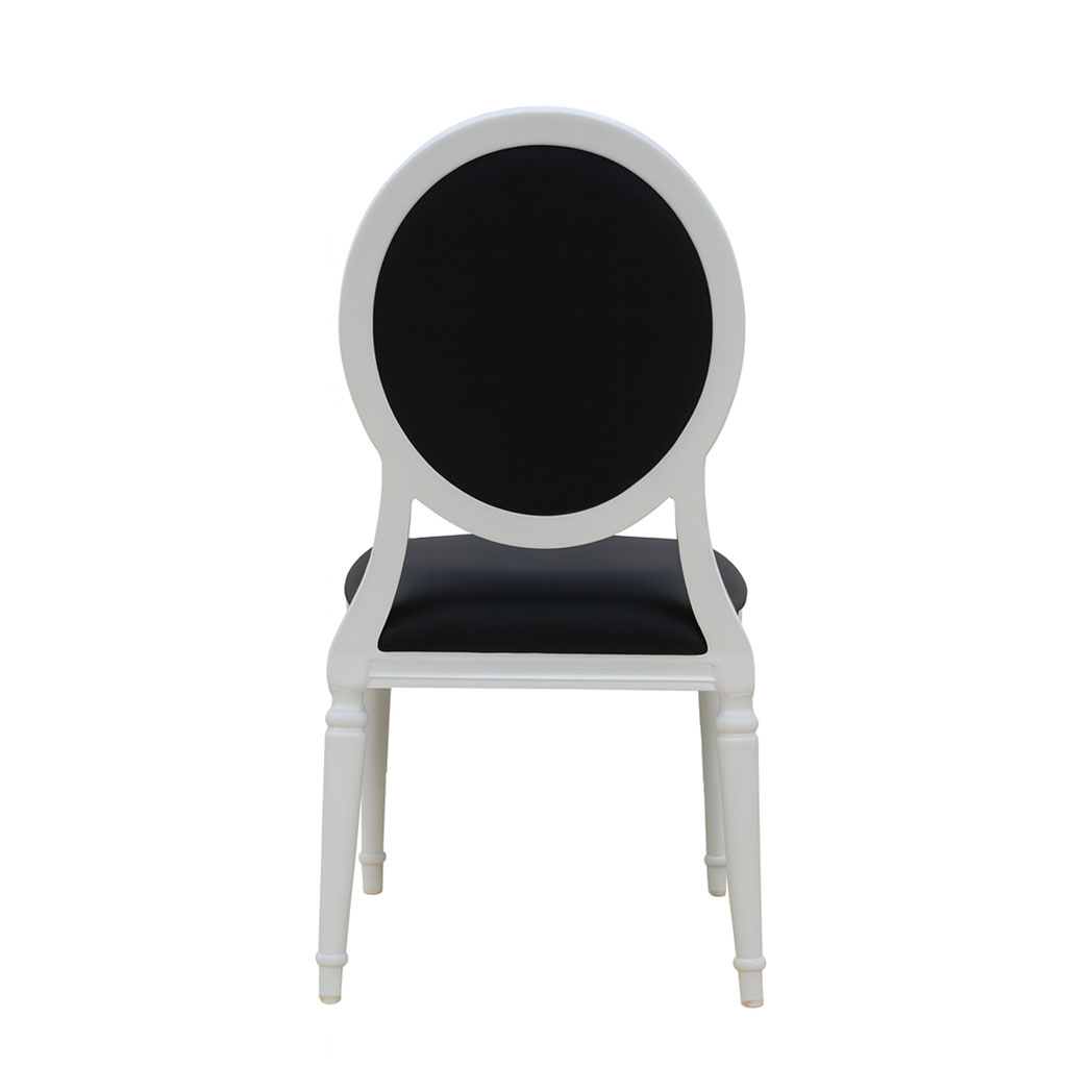 Back view of a Louis-style hotel dining chair with white wooden frame and smooth black upholstered backrest