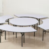 Modular concentric banquet tables forming a center round with one outer ring in white PVC