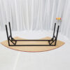 Upturned half-moon banquet table showing black folding legs and reinforced steel frame
