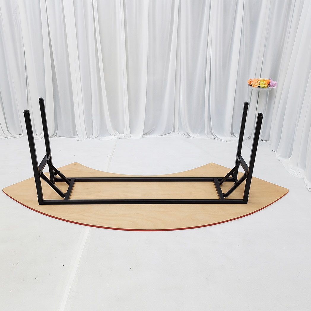 Upturned half-moon banquet table showing black folding legs and reinforced steel frame