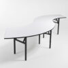 White PVC top serpentine banquet table in S shape with folding black metal legs for weddings and events