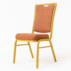 Side view of red banquet chair with patterned fabric upholstery and gold powder-coated steel frame.