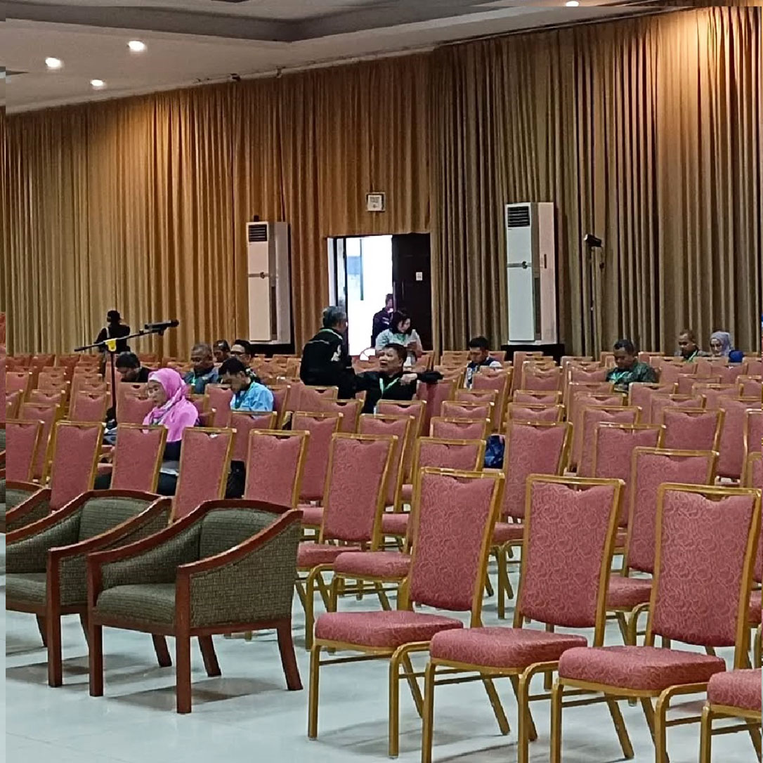 Hotel dining hall with banquet tables and red stacking chairs at Sheraton Langkawi