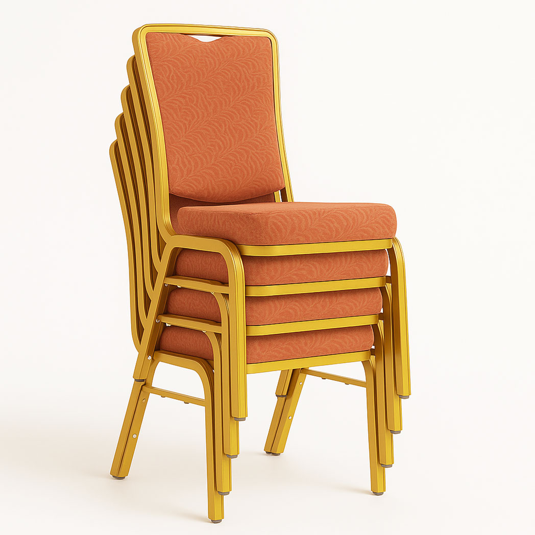 Stack of red upholstered banquet chairs with patterned fabric and gold steel frames.