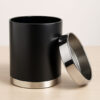 Black hotel waste bin with removable polished stainless steel top ring