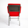 Back view of aluminum church chair with book rack and red upholstered seat, commercial stackable church seating with metal frame