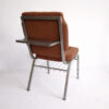 back view aluminum church chair with writing tablet upholstered brown fabric seat and metal frame with book rack