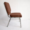 side view aluminum church chair upholstered brown fabric stackable metal frame seating with under seat book rack