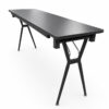 Side perspective view of a folding conference table with angled twin-column steel legs, laminate tabletop, and commercial-grade frame construction.