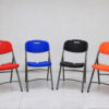 Aurora folding plastic banquet chairs in multiple colors including red, blue, black, and orange, commercial event seating