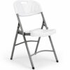 Aurora folding plastic banquet chairs arranged around round table in outdoor event setup, commercial seating solution