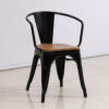 Commercial Tolix dining chair with arms featuring a natural wood seat and black powder-coated steel frame for restaurants, cafes and hospitality spaces.