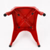 Underside structure detail of a commercial Tolix dining chair with arms showing reinforced X-brace steel support and welded frame construction.