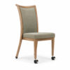 Curved Back Aluminum Dining Chair with Front Casters in light oak wood grain finish and sage gray upholstered seat and back, angled view for hospitality dining spaces.