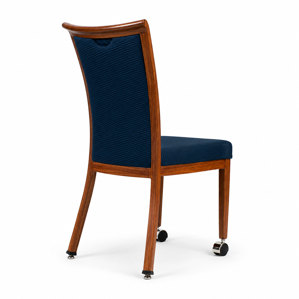 Curved Back Aluminum Dining Chair with Front Casters, rear angle view, wood grain aluminum frame with navy upholstered seat and back for hospitality dining spaces.