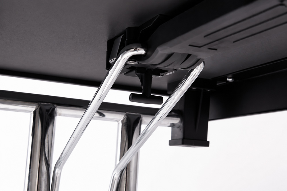 Close-up detail of folding conference table steel frame locking mechanism and support structure