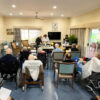 Heritage Aluminum Arm Dining Chairs in use at a senior living community activity room, providing comfortable seating for residents during group events and daily activities.